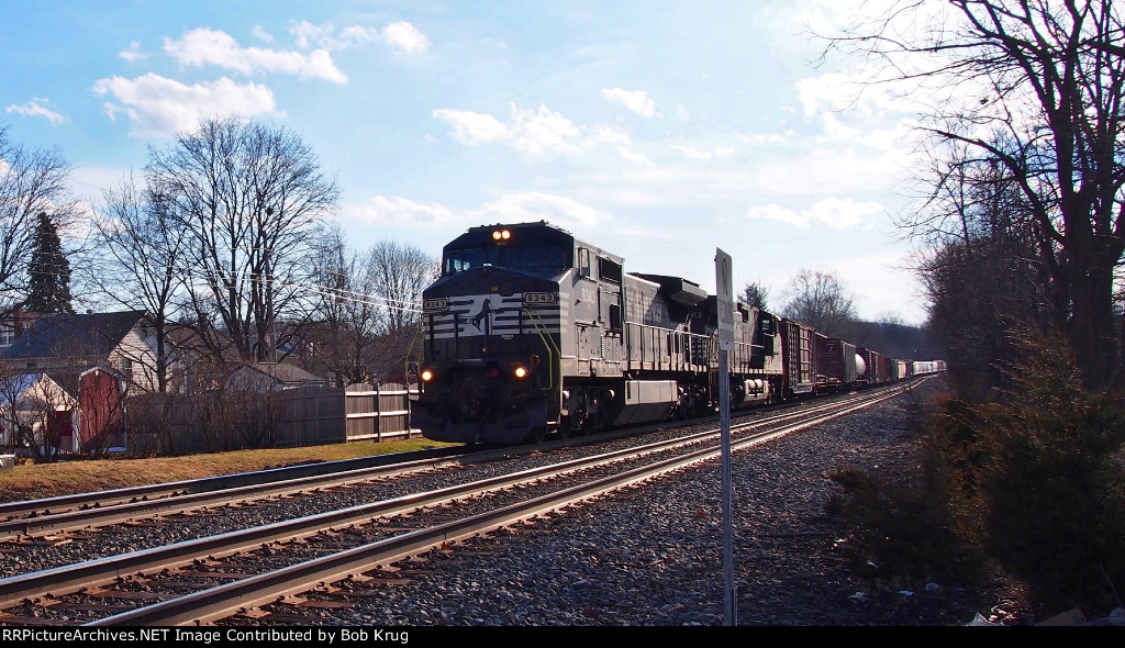 NS 8343 and 8913 lead an eastbound manifest freight down the hill into Emmaus